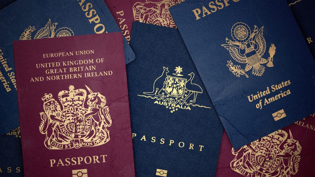A mix of burgundy and navy passports from around the world