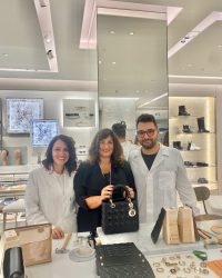 Luciana at the Manchester Dior store alongside two Dior staff